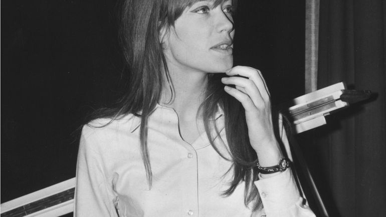 French singing star, Francoise Hardy, looks at a music score...