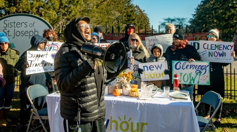 Pamela Neely of Huntington speaks at a rally outside Sisters...