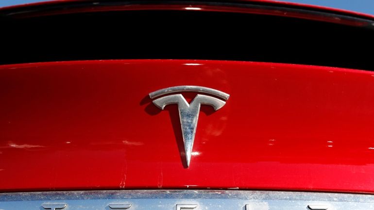 The Tesla logo appears on an unsold 2020 Model X...