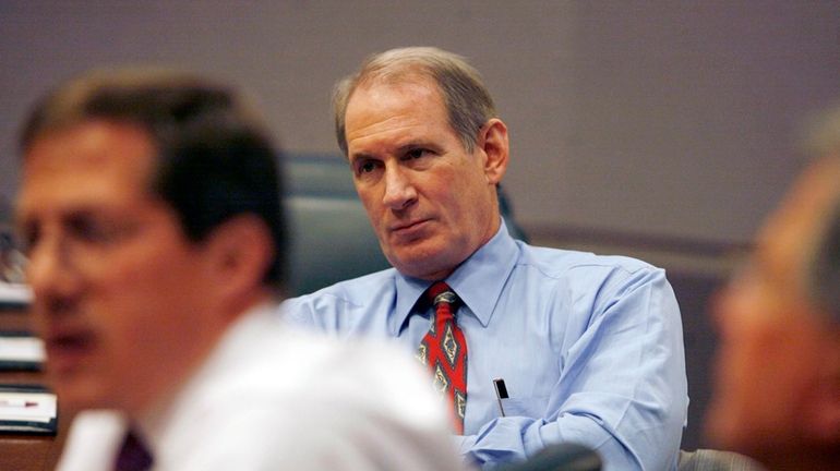 James Crown, University of Chicago board of trustees chair, listens...