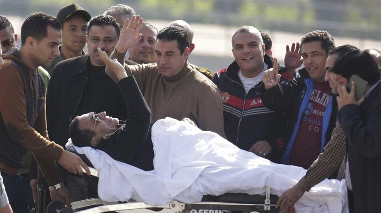 Former Egyptian President Hosni Mubarak, 86, greets medics, army personnel...