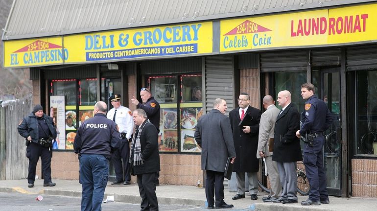 Suffolk County Police investigate a fatal shooting inside the El...