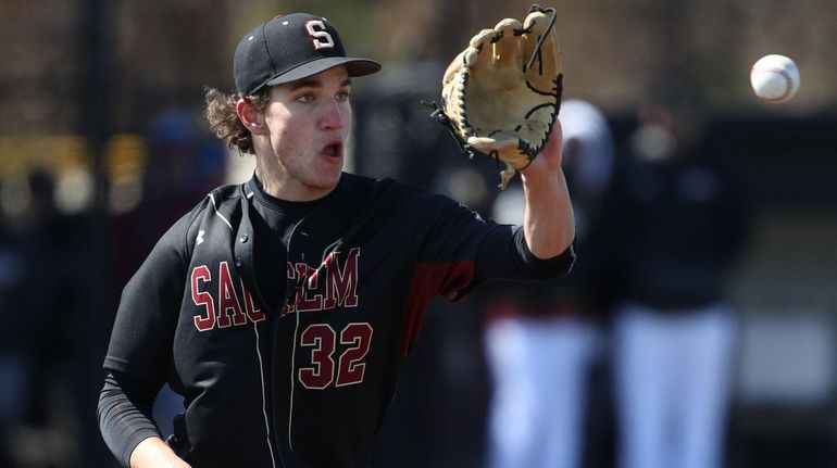 Sachem East's Roman Dorosh makes the catch and the out at...