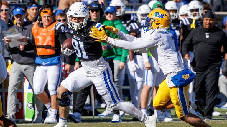 Duke's Nicky Dalmolin (81) carries the ball as Pittsburgh's Javon...