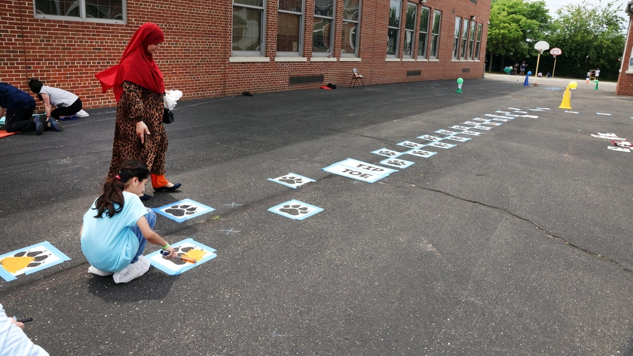 Elmont's Gotham Avenue School gets splashes of color on blacktop beautification project