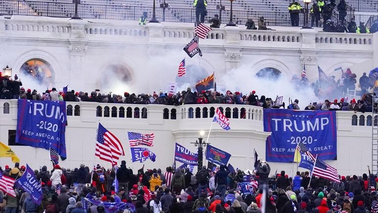 Rioters at the U.S. Capitol on Jan. 6, 2021, in...