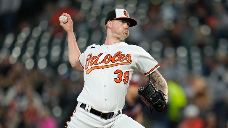 Baltimore Orioles starting pitcher Kyle Bradish throws to the Washington...