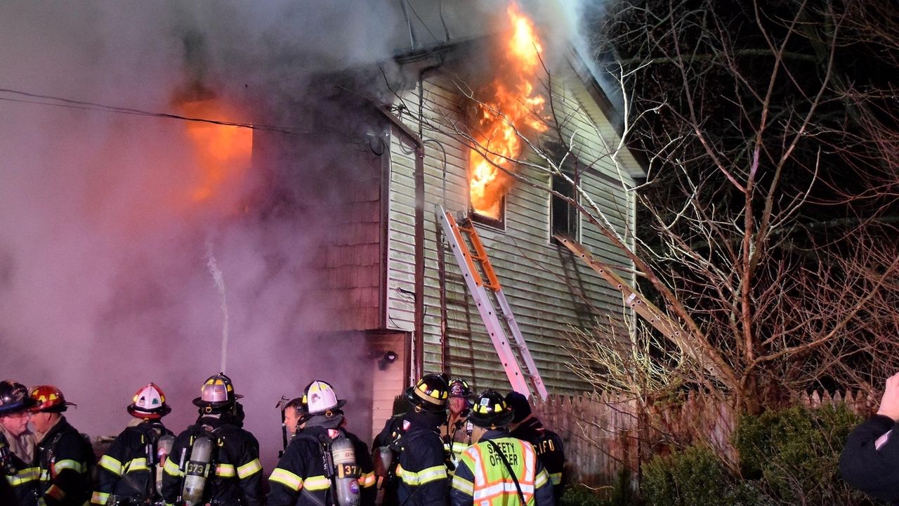 Firefighters rescue woman trapped on blazing second floor of home Newsday(02)