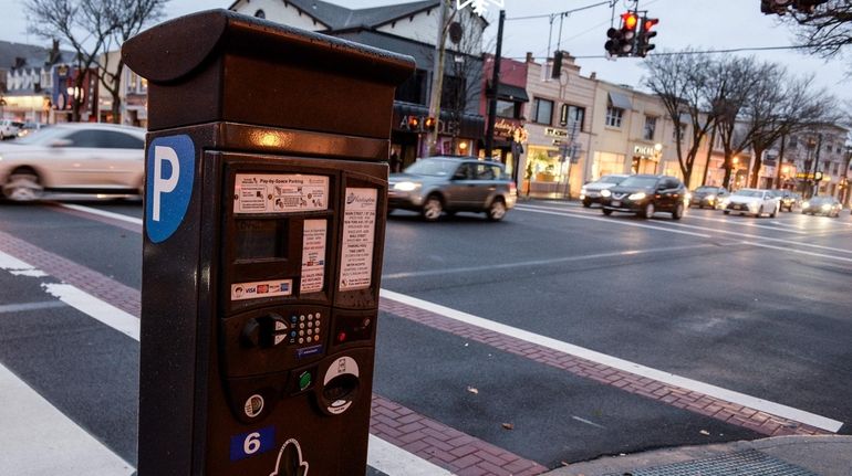 Huntington Town now requires parking tickets to be paid in...