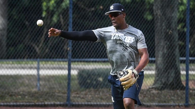 New York Yankees Miguel Andujar takes infield drills during Spring...