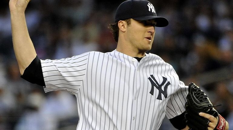 Yankees' Phil Hughes pitches in the first inning against the...