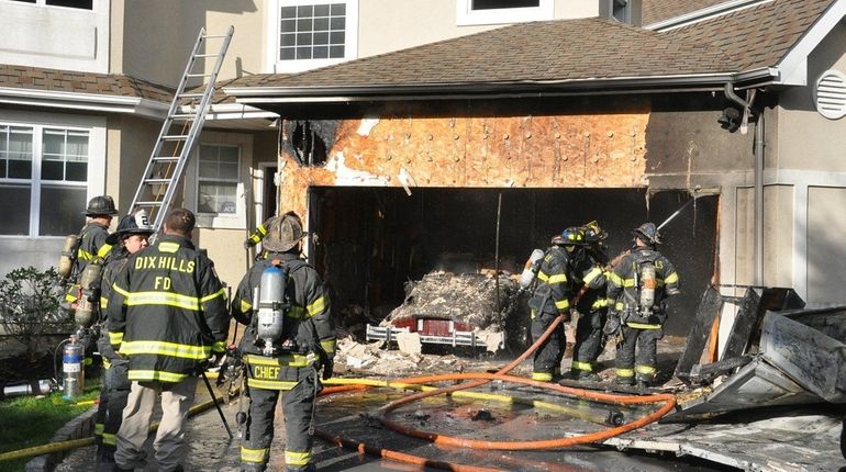 Dix Hills firefighters respond to a blaze at The Gates...