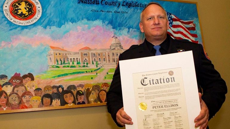 Nassau Police Officer Peter Ellison, who has collected toys for...