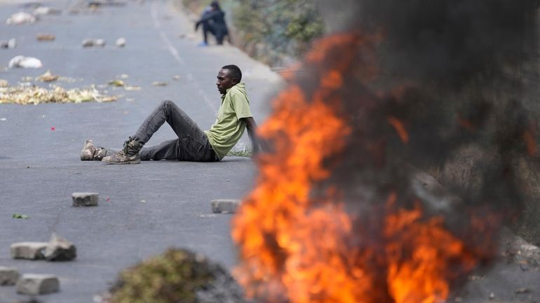 Protesters block the busy Nairobi - Mombasa highway in the...