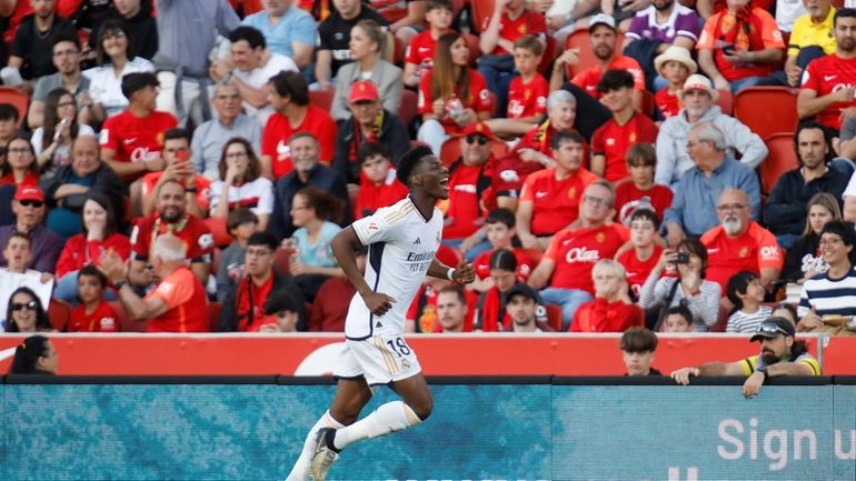 Real Madrid's Aurelien Tchouameni celebrates after scoring the opening goal...