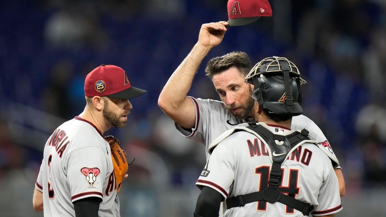 Cardinals unveil new uniforms, D-backs designate Madison Bumgarner for  assignment: top sports stories