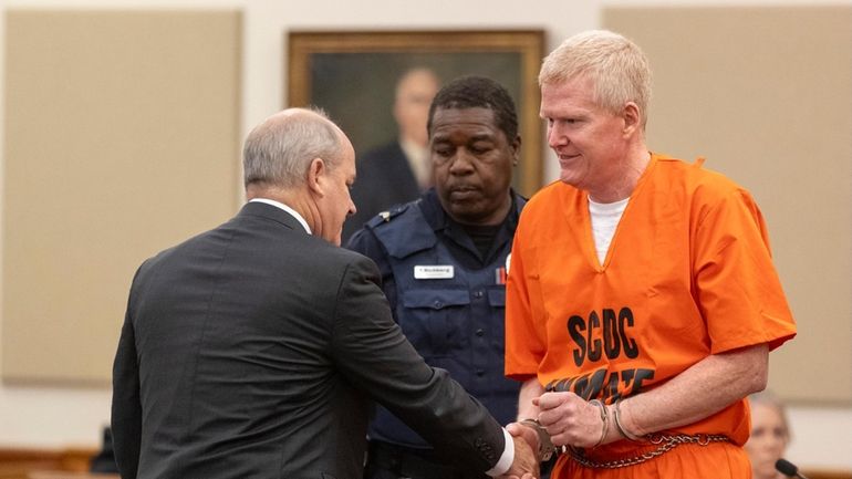 Alex Murdaugh shakes hands with his attorney Jim Griffin during...