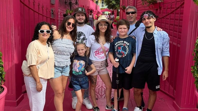 Elisa Irvolino, of Patchogue, left, and her extended family have...