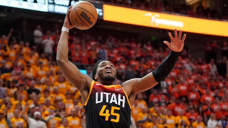 Jazz guard Donovan Mitchell goes to the basket during the...