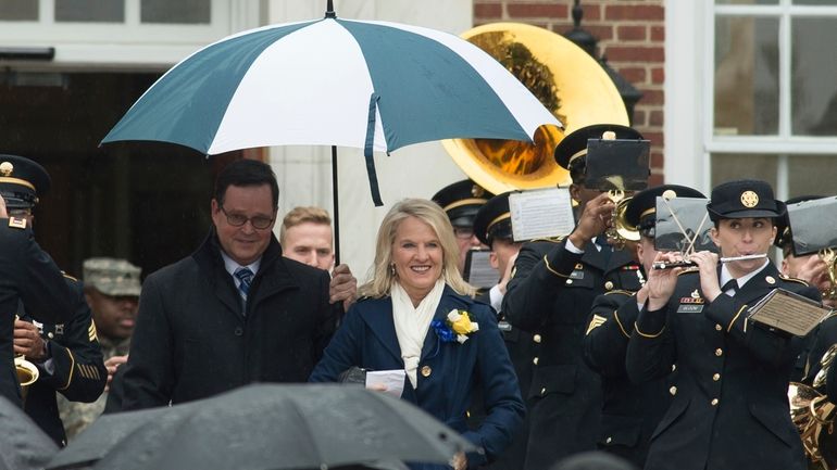 Delaware Lt. Gov. Bethany Hall-Long and her husband Dana walk...