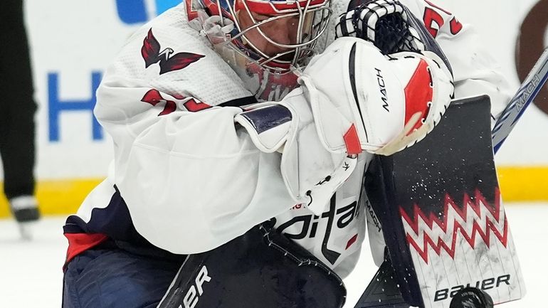 Washington Capitals goaltender Charlie Lindgren (79) makes a blocker save...