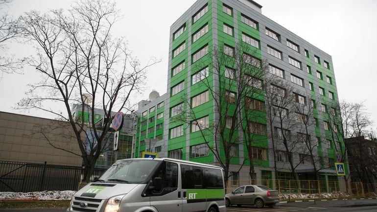 A car of Russian state-owned television station RT passes by...