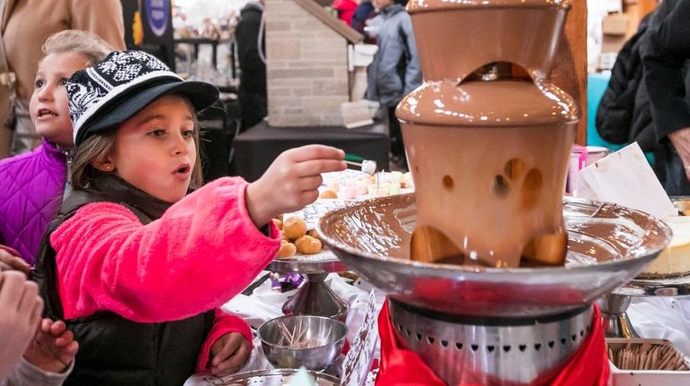 Lily Giannattasio, 7, of Little Neck in the process of...