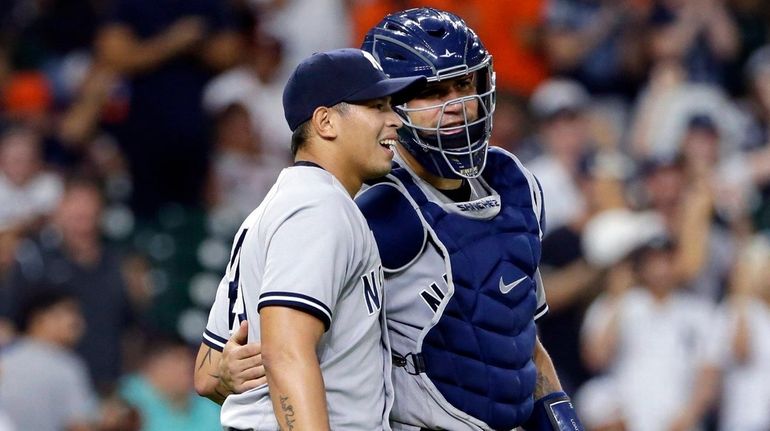 Yankees closing pitcher Jonathan Loaisiga, left, and catcher Gary Sanchez,...