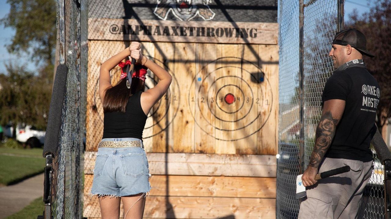Mobile axthrowing company brings the cage to your Long Island driveway