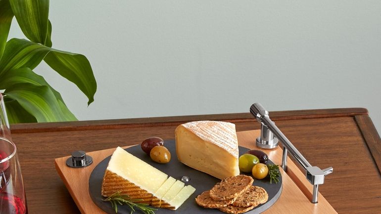 This image released by Uncommon Goods shows a cheese board...