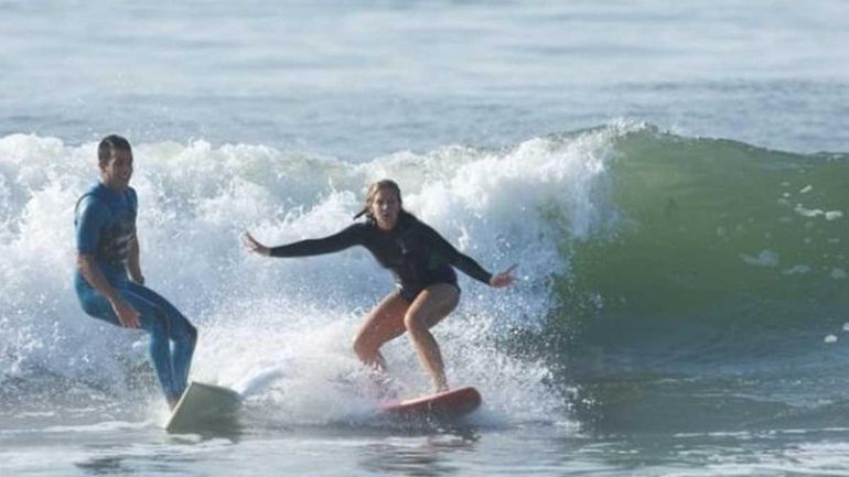 Daniel Bobis and his wife, Rachel, surfing. (July 25, 2011)