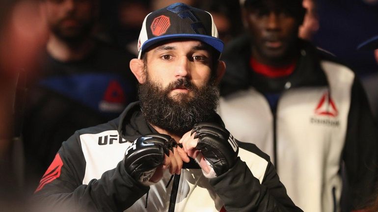 Johny Hendricks walks to the octagon to face Neil Magny...