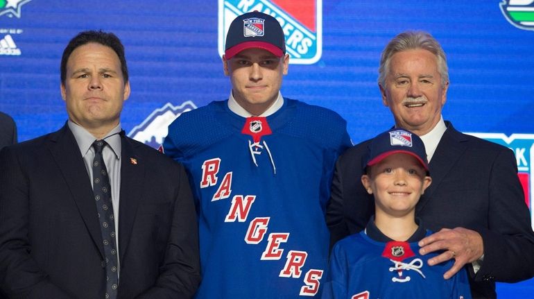 Rangers draft pick Kaapo Kakko, center, poses during the first...