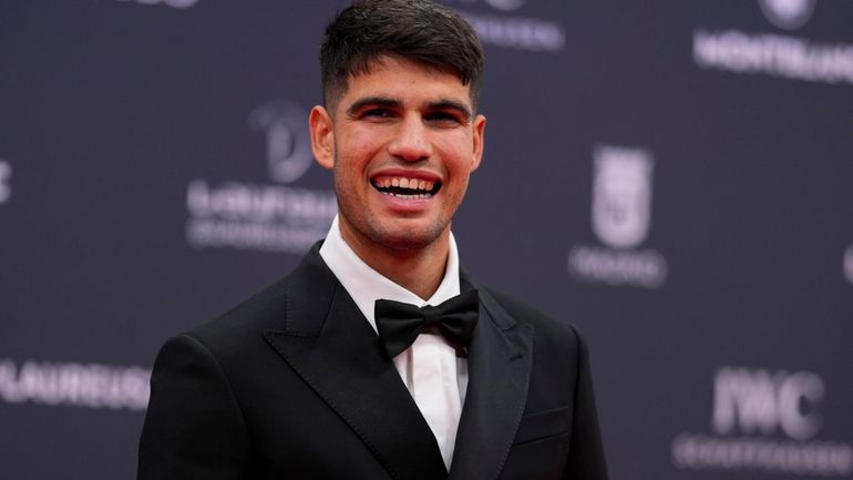 Spanish tennis player Carlos Alcaraz poses on the red carpet...