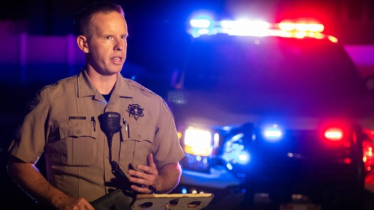 Weber County Sheriff's Sgt. Sean Endsley briefs members of the...