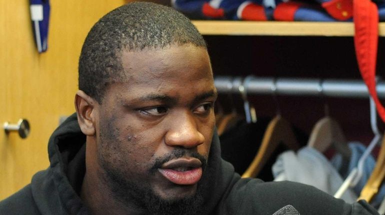 New York Giants linebacker Jameel McClain speaks to the media...