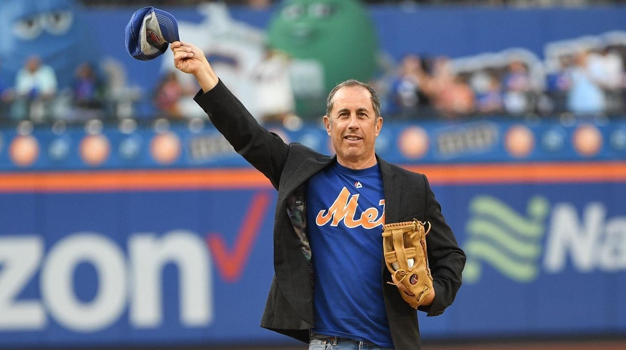 Jerry Seinfeld throws out the first pitch before a game between the