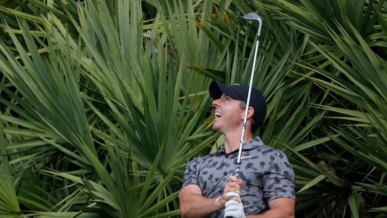 Rory McIlroy of Northern Ireland hits from the rough on...