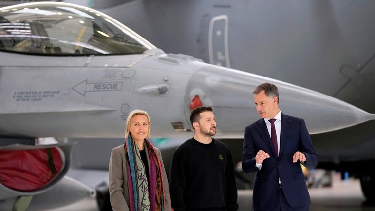 Belgium's Prime Minister Alexander De Croo, right, and Belgium's Defense...