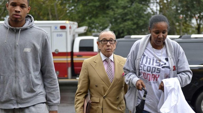 Esaw Garner, her son Eric Jr. and attorney Sanford Rubenstein...