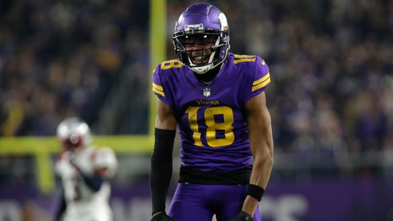 Minnesota Vikings wide receiver Justin Jefferson celebrates after catching a...