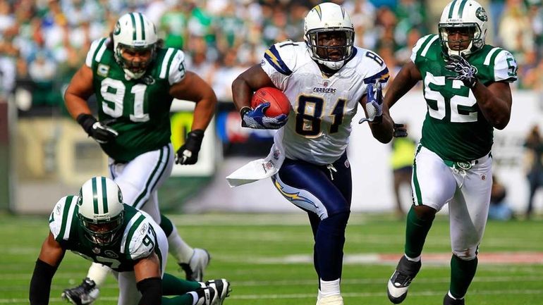 Randy McMichael runs with ball against the New York Jets...