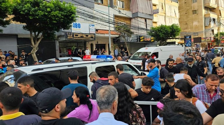 Ambulances arrive at the scene of an Israeli missile strike...