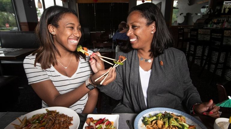 Taylor White, left, and her mom Xiomara White, both from...