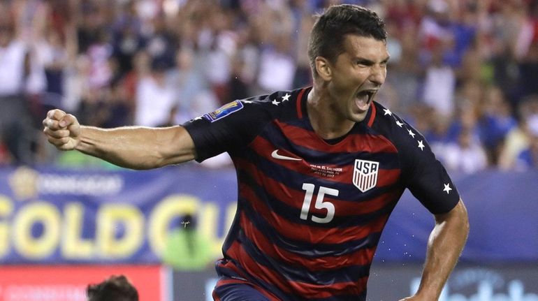 The United States' Eric Lichaj reacts after scoring against El...