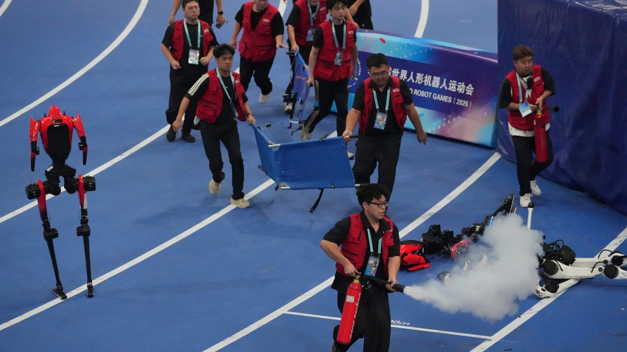 A robot sprinter shatters a 100-meter record again as sparks fly at ...