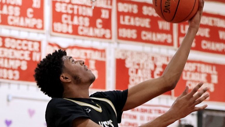 West Hempstead forward Isaiah Blunt drives the baseline with the...