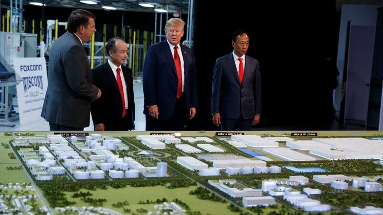 President Donald Trump tours a Foxconn facility, June 28, 2018,...