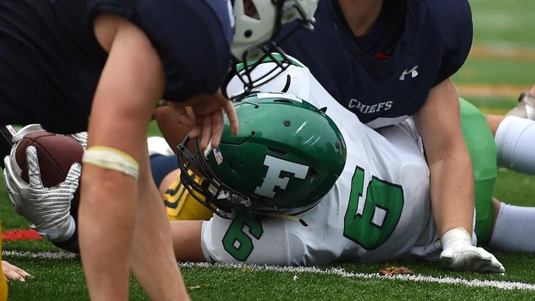 Farmingdale's Sal Posillico lunges into the end zone for a...