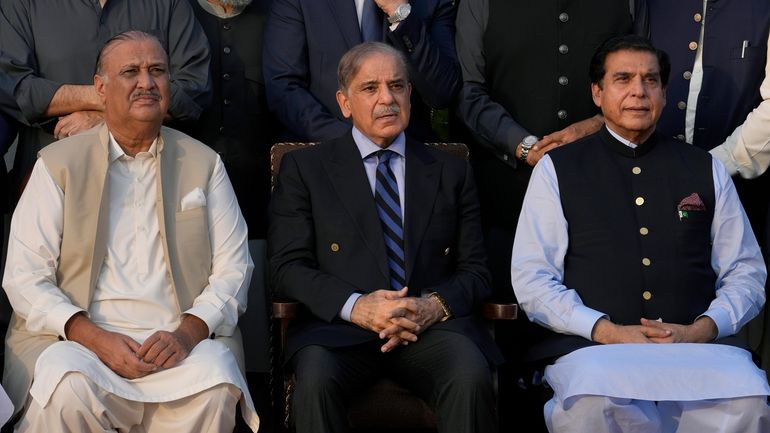 Pakistan's Prime Minister Shehbaz Sharif, center, Speaker Raja Pervez Ashraf,...